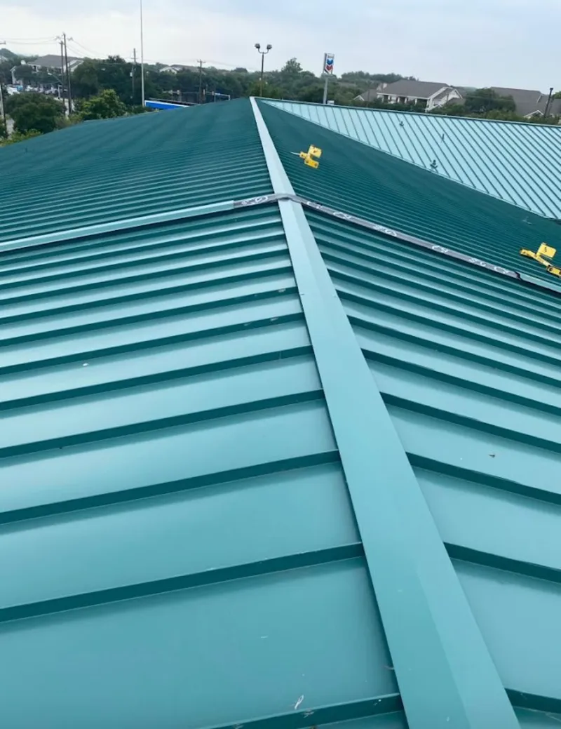 Green commercial metal roof ridge and valley for Metal Roof Repair in Paola