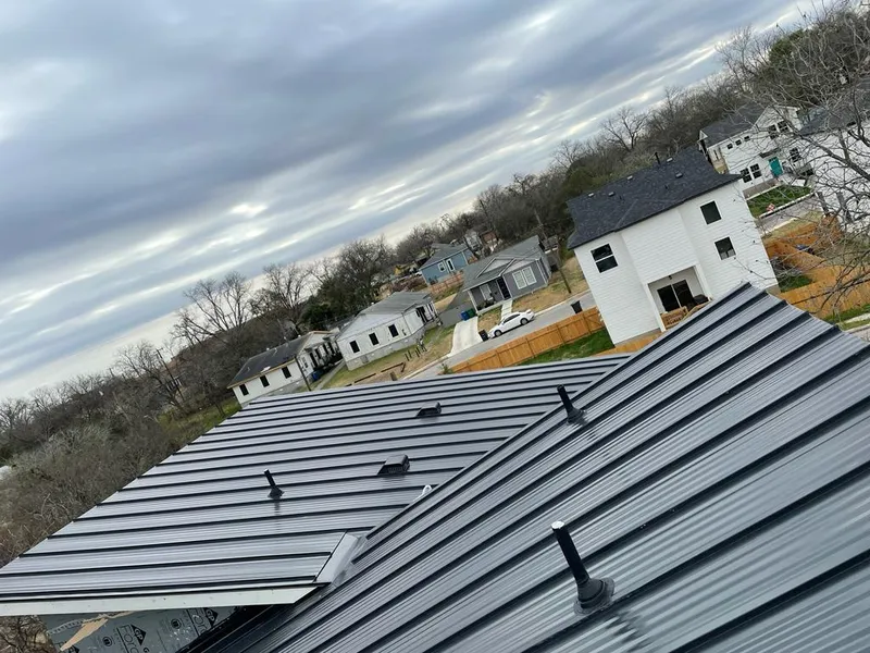 Standing seam metal roof panels with vents for Skylight Repair in Paola